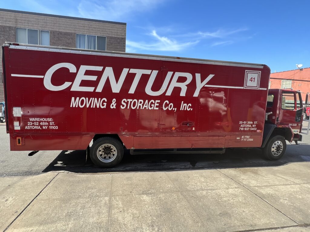 Century Moving & Storage Truck Parked On Right Side Of Road